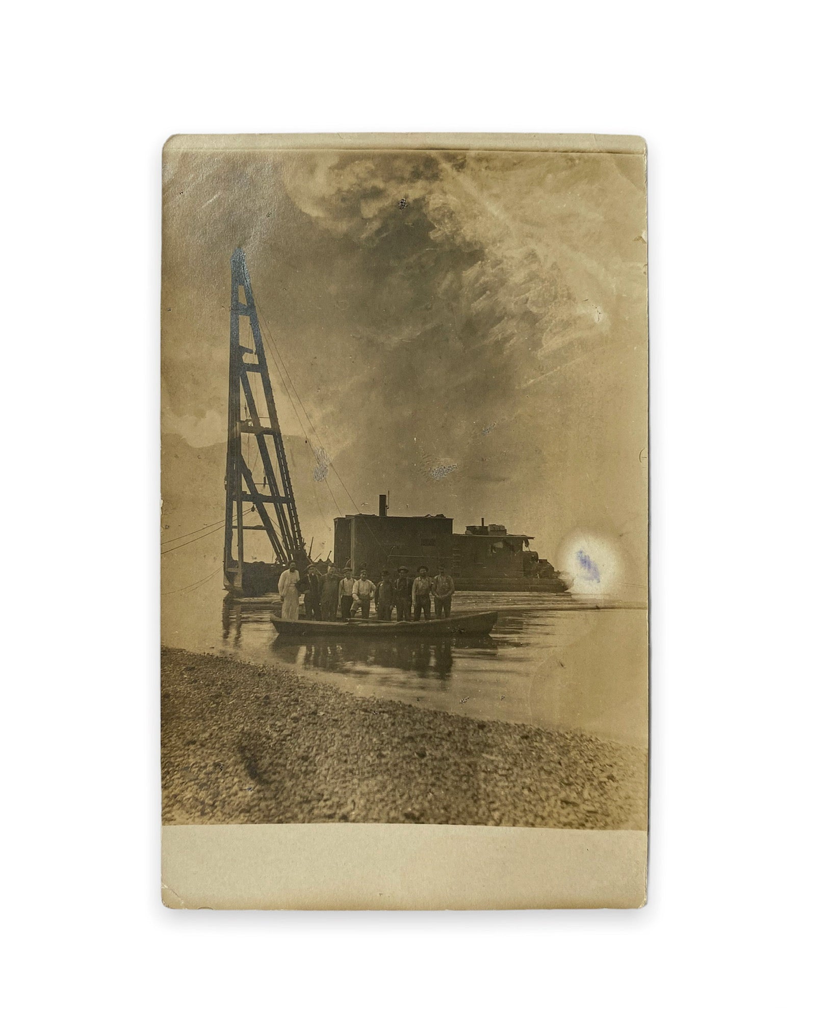 Men Standing in Boat with Stunning Cloud Form Above RPPC